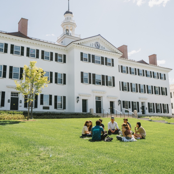 Students sitting outside of Dartmouth Hall